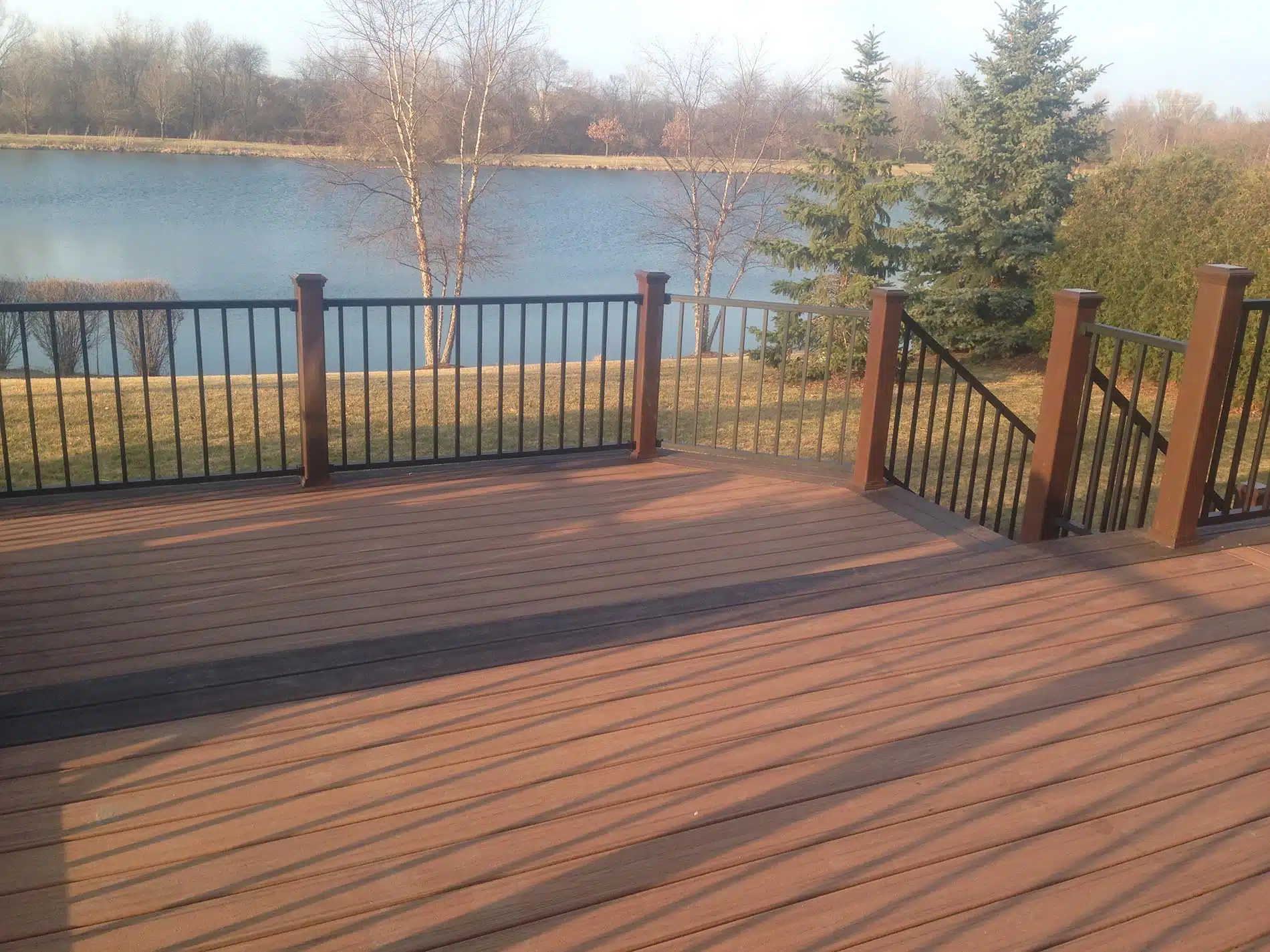 brown raised deck with railing 12