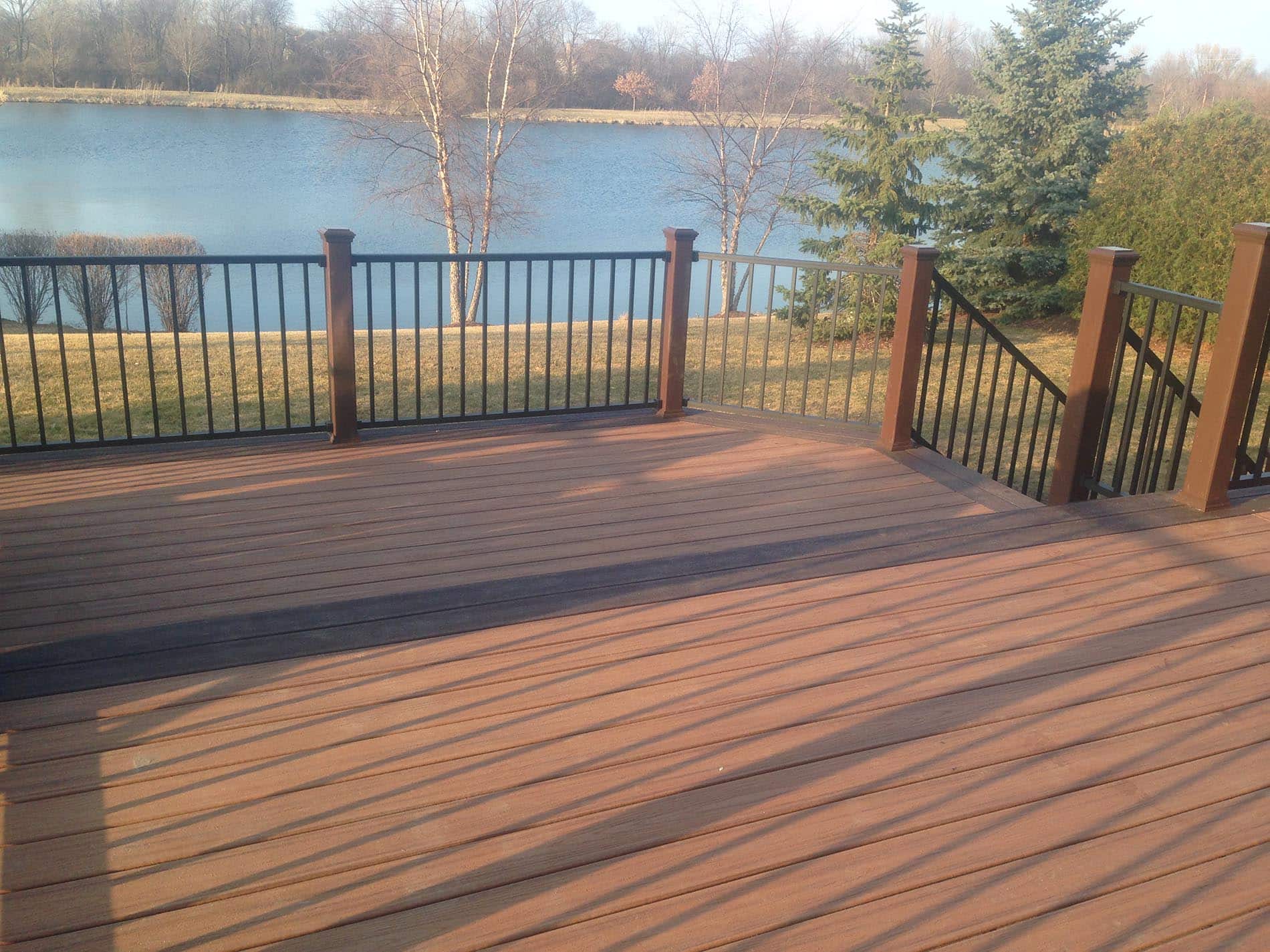 brown raised deck with railing 13