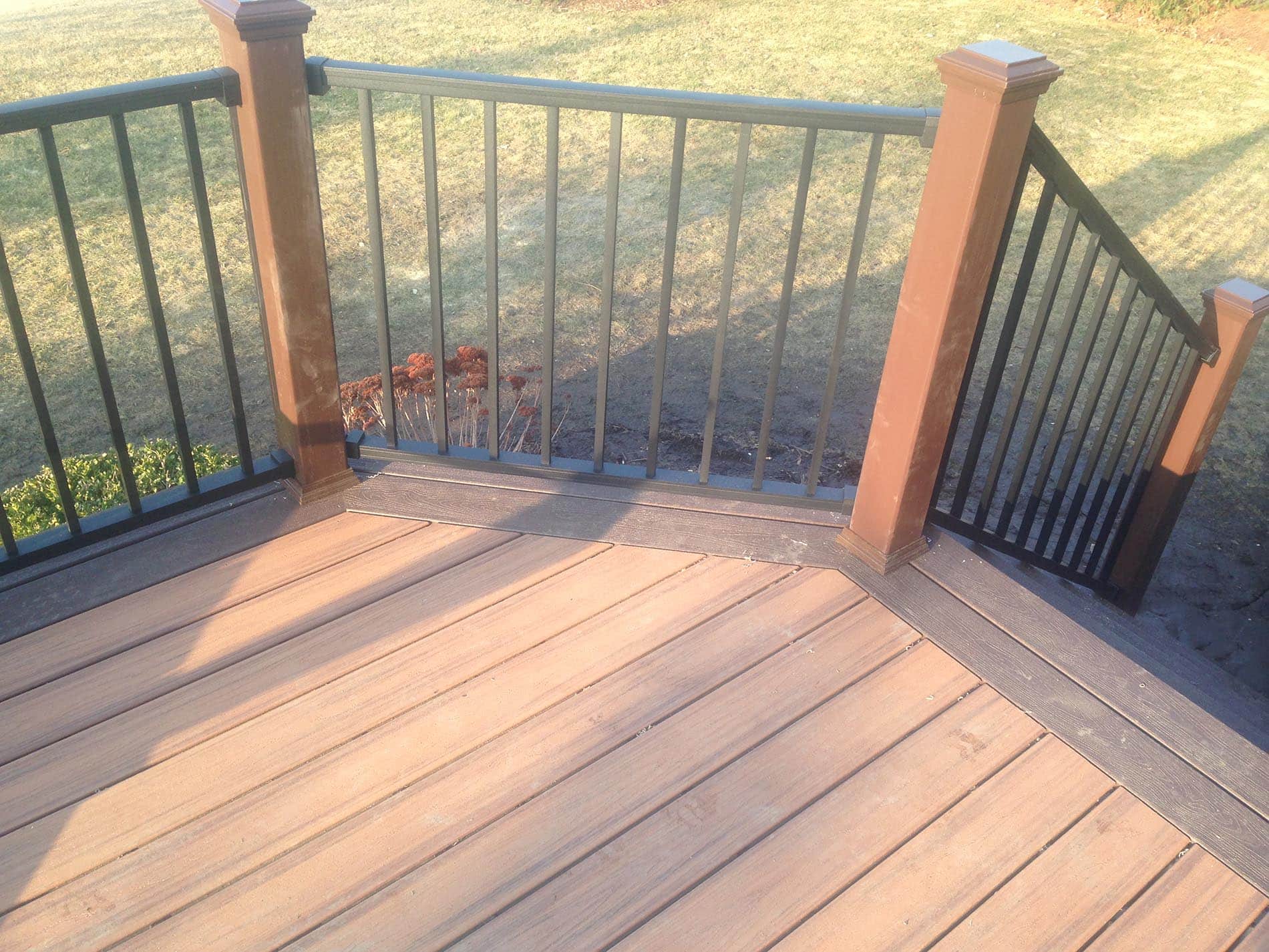 brown raised deck with railing 3