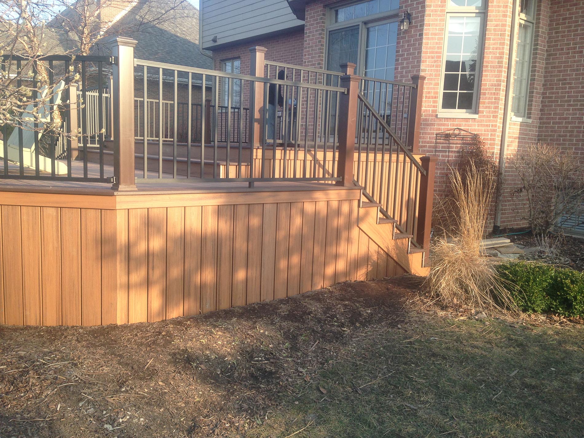 brown raised deck with railing 6
