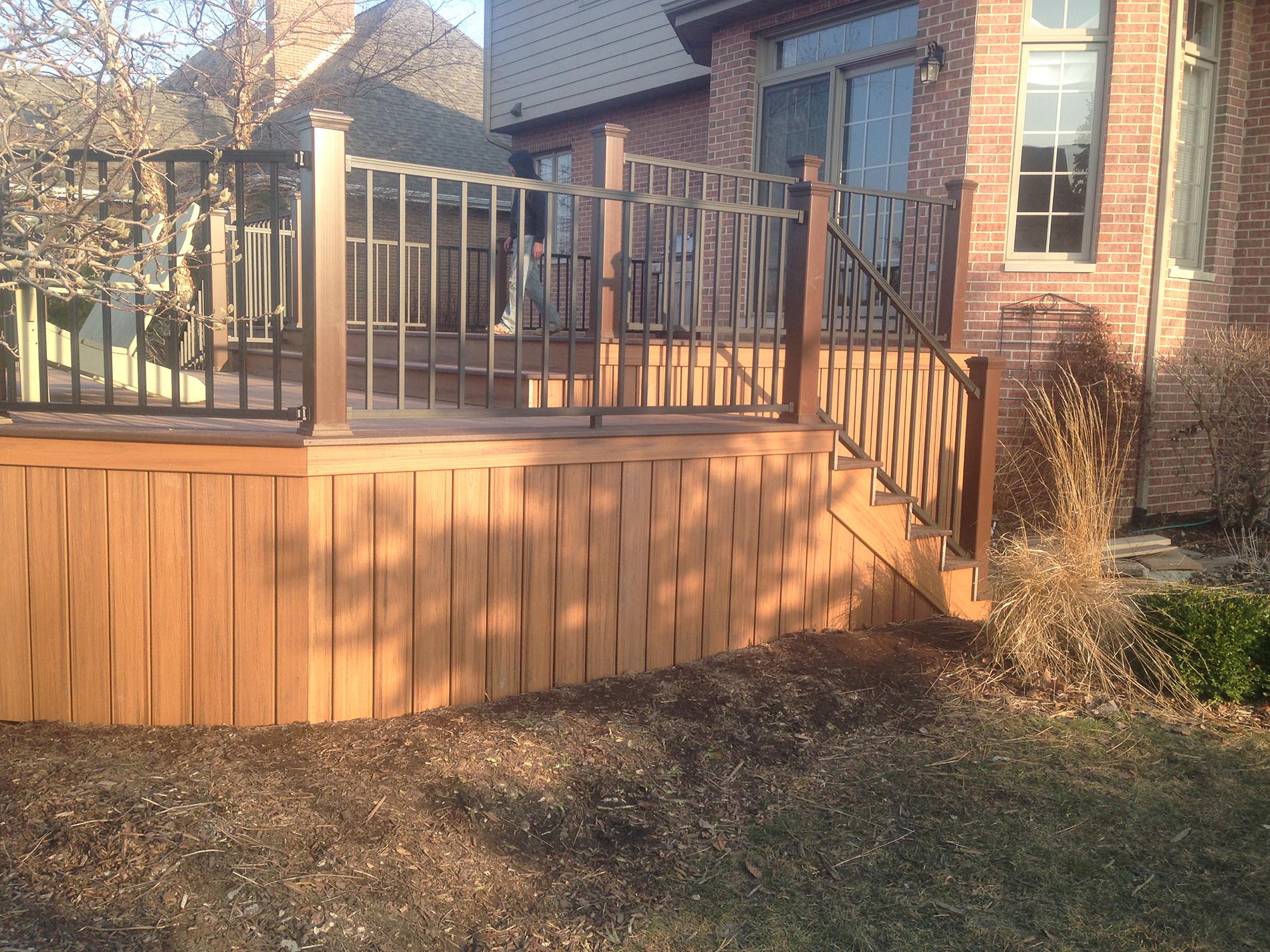 brown raised deck with railing 7
