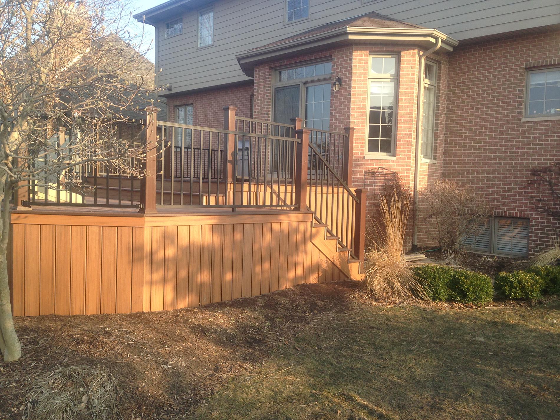 brown raised deck with railing 8