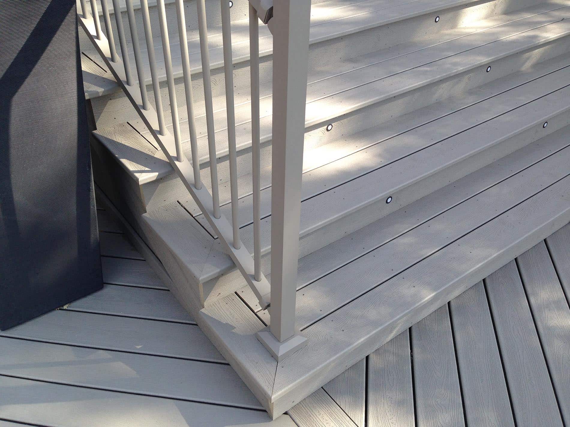 gray deck with metal railing 22