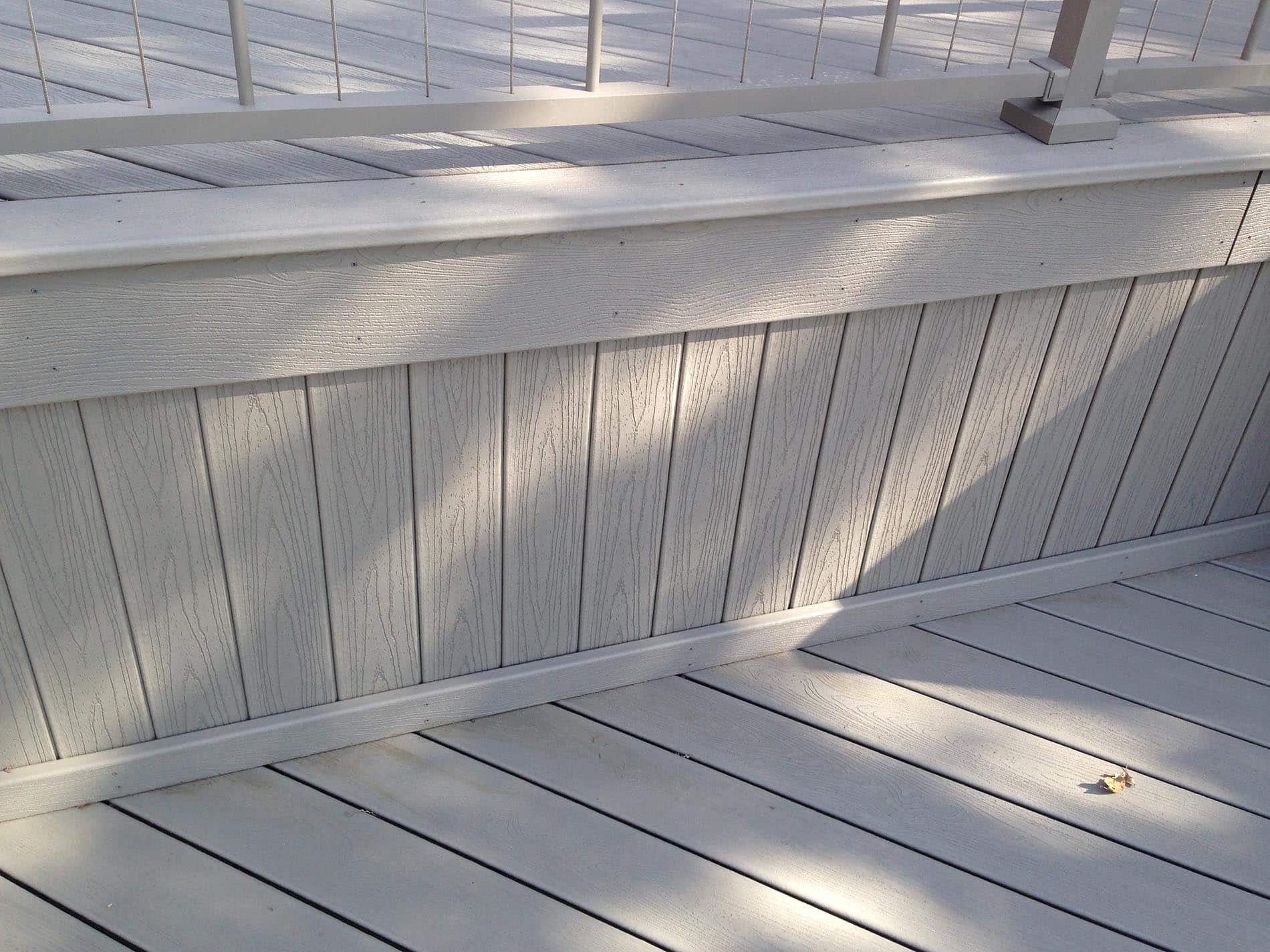 gray deck with metal railing 24